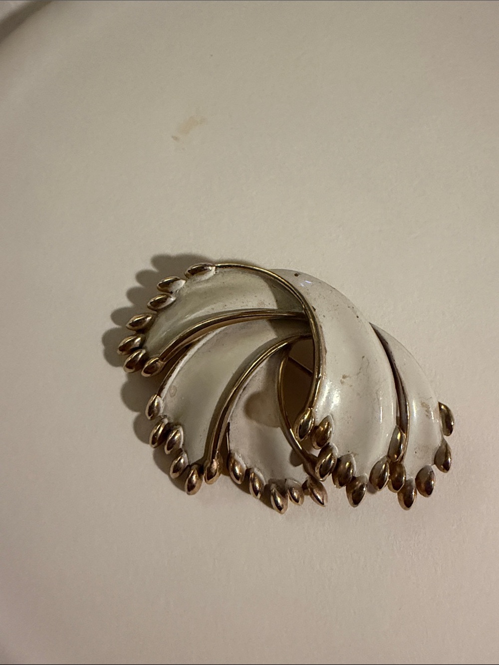 Vintage Crown Trifari White and Gold Swirl Enamel Brooch